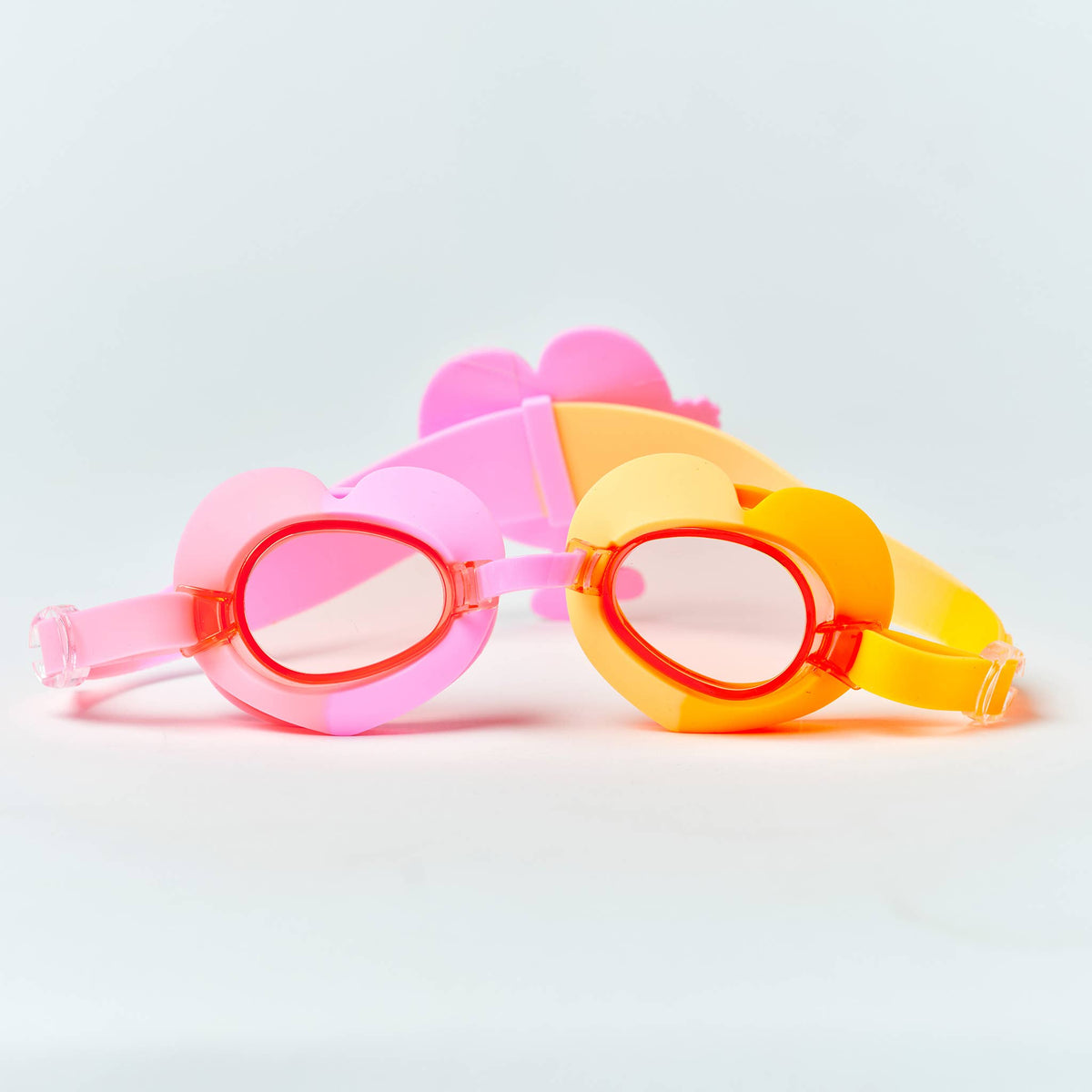 Sunnylife Poppy the Peach swimming goggles featuring colorful, playful design with adjustable straps for kids' swim safety.