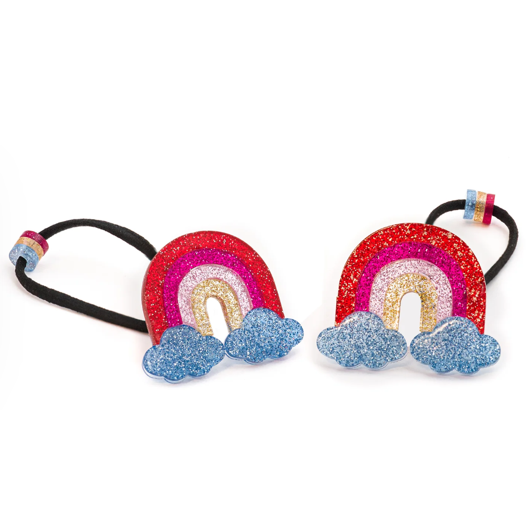 Rainbow glitter ponytail hair accessory by Lilies & Roses NY featuring vibrant rainbow glitter and sleek elastic band.