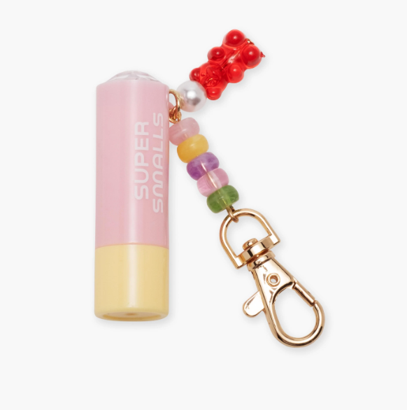 Super Smalls Candy Cutie Lip Balm Key Chain featuring a colorful, candy-themed design and attached key ring for easy carrying.