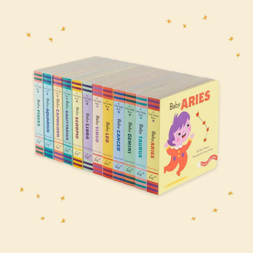 A Little Wyld Aries Zodiac Board Book featuring colorful illustrations of the Aries symbol and related artwork for children.