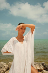 Metallic weave thobe in seafoam from pītusa, showcasing a stylish, textured traditional garment with metallic accents.