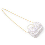 Pink girls' tweed jumbo pearl bow handbag by Tiny Treats and ZOMI GEMS featuring a stylish design with pearl accents.