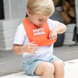 Bella Tunno Party Animal Wonder Bib in vibrant orange, soft waterproof fabric with fun animal print for baby feeding time.