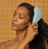 KITSCH Haze Blue detangling hair brush with flexible bristles on a white background