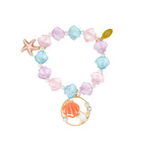 Mermaid seashell bracelet tower by Tiny Treats and ZOMI GEMS showcasing handcrafted jewelry with seashell and mermaid-inspired design.