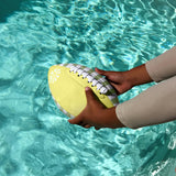 Neoprene football with citrus design by Sunnylife, suitable for beach or pool play, featuring vibrant colors and durable material.