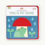 A First Felt Book titled "This Is My Home" with colorful felt pages showing a cozy house scene for young children.