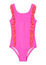 Neon pink and red Stella Cove ruffle swimsuit with adjustable straps and ruffled hem, displayed on a hanger.