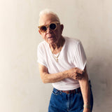 SARDINE Aster Toasted Moxie round checkered sunglasses with a bold black and white checkered pattern and round frame design.