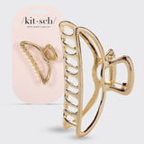 Gold open shape claw clip by KITSCH, showcasing a stylish, large hair accessory with a sleek, modern design.