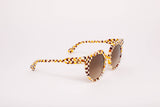 SARDINE Aster Toasted Moxie Round Checkered sunglasses with patterned frames and dark lenses, stylish accessory for sunny days