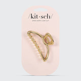 Gold open shape claw clip by KITSCH, showcasing its stylish, minimalist design perfect for securing hair.