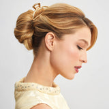 Gold open shape claw clip by KITSCH, stylish hair accessory with a modern open design and shiny gold finish.