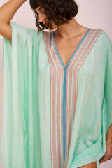 Aqua checkered sequin thobe by pītusa featuring a traditional long Islamic garment with sparkling sequins and checkered pattern.