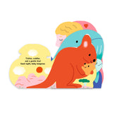 Close-up of a children's bedtime storybook titled "Bedtime Kisses" by Chronicle Books, featuring colorful illustrated cover art.