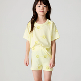 Chaser Happy Happy Shorts in bright, colorful fabric with a relaxed fit, displayed on a hanger.