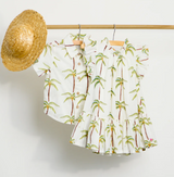 Pink Chicken Cream Palm Trees Harper Dress with a floral pattern, featuring a light, breezy fabric and sleeveless design.