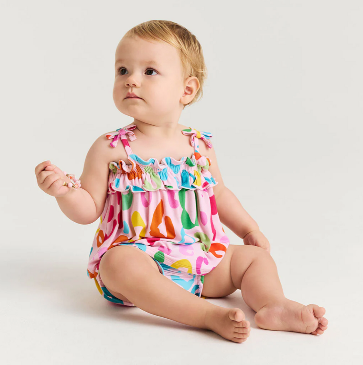 Luella Posh Peanut Bow Strap Ruffled Top and Bummie Set for babies, featuring a cute bow strap and ruffled design.