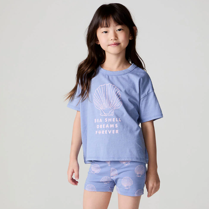 Chaser Seashell Dreams T-shirt featuring a colorful seashell graphic on soft fabric, casual summer wear for women.