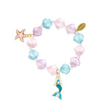 Mermaid seashell bracelet tower featuring colorful shell charms and ocean-inspired details by Tiny Treats and ZOMI GEMS