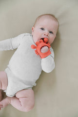 Itzy Ritzy Crab Bitzy Grip™ baby teething toy with soft silicone and colorful crab design on a white background.