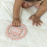 Bella Tunno Moms Mini Me Happy Teether showing soft silicone surface and colorful design for soothing infants' gums.