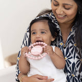 Bella Tunno Moms Mini Me Happy Teether showing colorful silicone design for soothing babies.