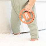 Bella Tunno Party Animal Teether in orange with animal design, soft silicone material for soothing babies' gums.