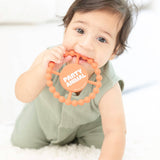 Orange Party Animal Teether by Bella Tunno, soft silicone teething toy featuring animal design for babies.