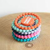 Bella Tunno Party Animal Teether in orange, soft silicone teether for babies, with playful animal design and textured surface.