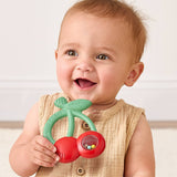 Itzy Ritzy Bitzy Shake silicone teether with rattle in cherry design, featuring soft silicone and colorful cherry shapes for baby teething fun.