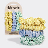 Set of five KITSCH ruched satin scrunchies in various vibrant colors, displayed on a neutral background.