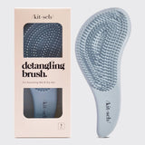 KITSCH detangling brush in Haze Blue with flexible bristles for gentle hair detangling and smooth styling.