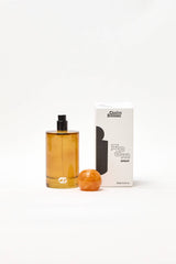 Choice Blooms Room Linen Fragrance Spray with Amber, Rose, and Oud scent, shown in a sleek spray bottle.