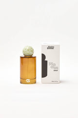 Choice Blooms Room Linen Fragrance Spray with Amber, Rose, and Oud scent, shown in a sleek spray bottle.