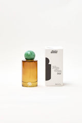 Room linen fragrance spray by Choice Blooms featuring amber, rose, and oud in a stylish bottle.