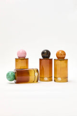 Choice Blooms Room Linen Fragrance Spray with Amber, Rose, and Oud scent, shown in a sleek spray bottle.