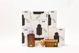 Room linen fragrance spray by Choice Blooms featuring amber, rose, and oud scent in a sleek spray bottle.