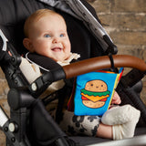 Foodie Baby crinkle fabric stroller book by Chronicle Books featuring colorful food-themed pages for infants.