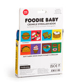 Foodie Baby crinkle fabric stroller book by Chronicle Books, colorful soft pages with food-themed illustrations for infants.
