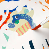 Mighty Dinosaurs Color Magic Water-Reveal Kit by Chronicle Books showing the water pen and colorful dinosaur illustrations.