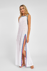 Petite Watermelon tassel slit dress by pītusa featuring a flowing silhouette and stylish tassel details.
