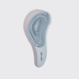 KITSCH detangling brush in haze blue with flexible bristles for gentle hair detangling and smooth styling.