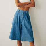 DL1961 Hepburn high-rise jean shorts with pleats and 12.5-inch inseam, shown in a light wash denim style.