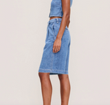 DL1961 Hepburn Jean Shorts with high-rise fit and pleats, featuring a 12.5-inch inseam, shown in light denim.