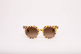 SARDINE Aster Toasted Moxie Round Checkered Sunglasses with brown and beige pattern and round frames.