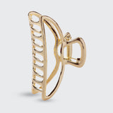 Gold open shape claw hair clip by KITSCH featuring a stylish, minimalist design for secure hair styling.
