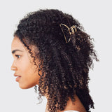Gold open shape claw clip by KITSCH, stylish hair accessory with a modern open design for securing hair.