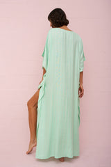 Aqua checkered sequin thobe by pītusa, featuring a traditional long dress with shimmering sequin pattern and checkered design.
