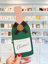 Champagne congratulation greeting card by Ginger P. Designs with toast illustration and celebratory message.